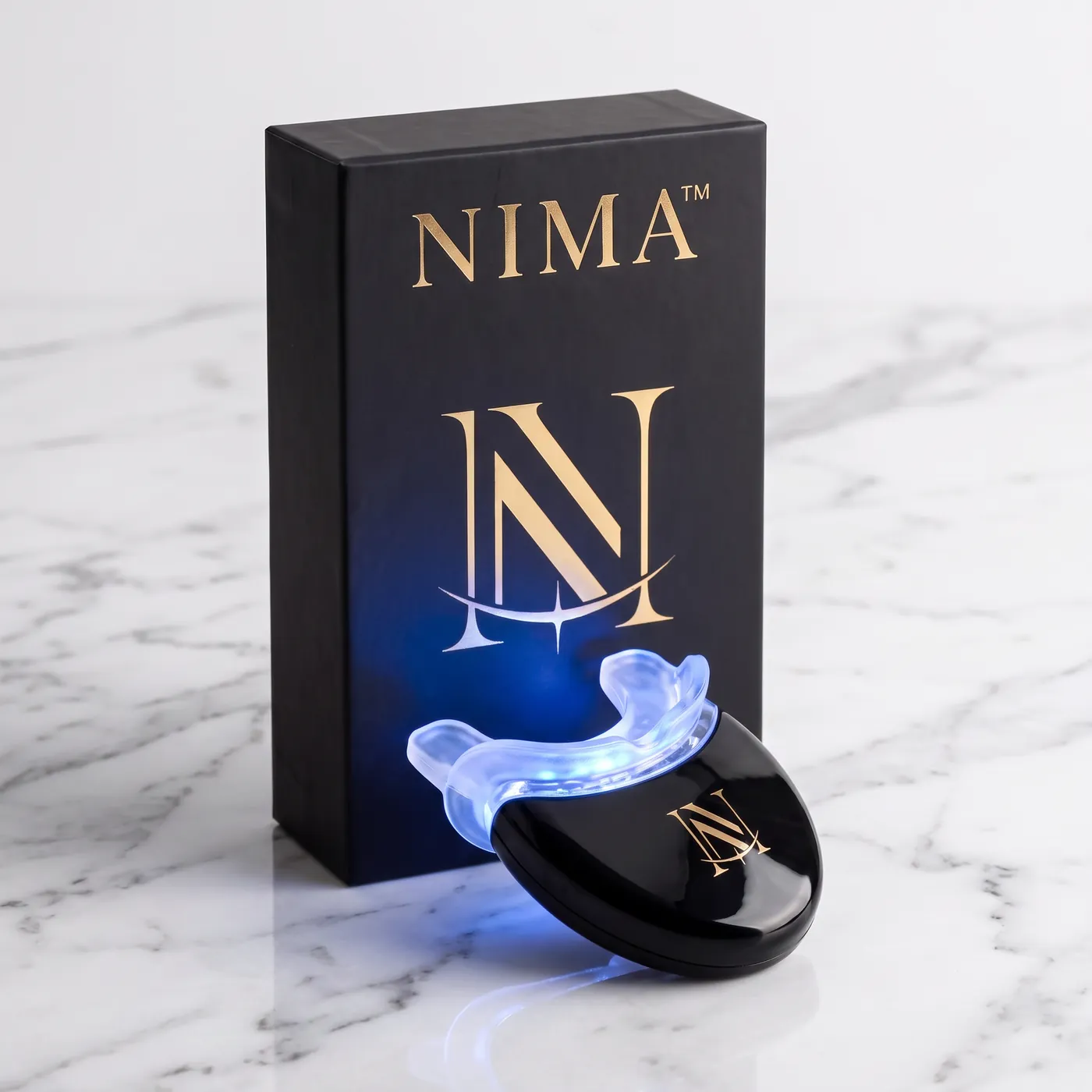 The NIMA LED device and box, mouthpiece glowing blue
