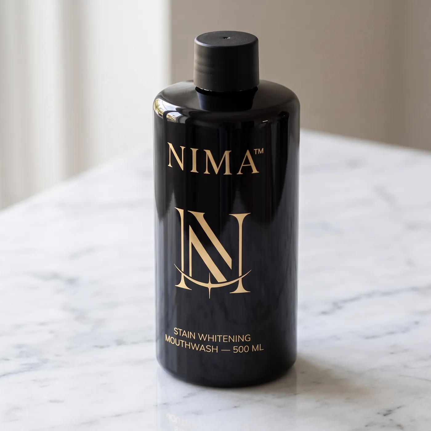 The NIMA mouthwash bottle on white marble