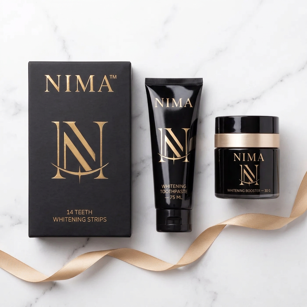 The branded NIMA Starter Kit with whitening strips, toothpaste and booster laid out with a gold ribbon